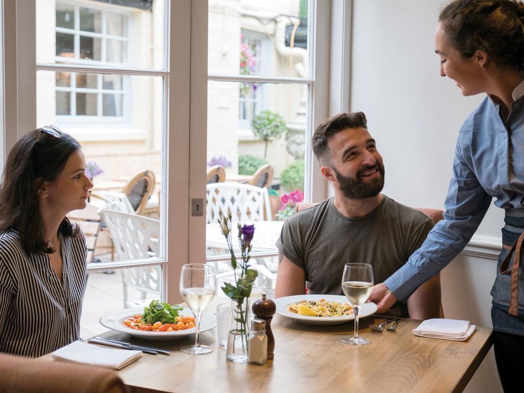The Fleece At Cirencester Εξωτερικό φωτογραφία A waitress serving customers